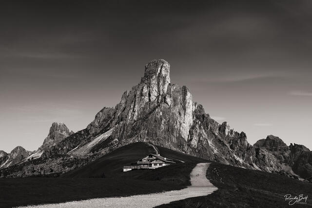 black and white photo of Ra Gusela at Passo Giau in the Italian dolomites with a hut
