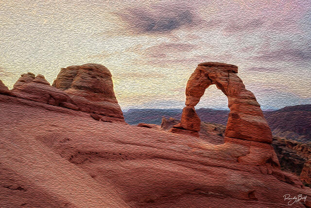 sunrise at delicate arch in arches national park.