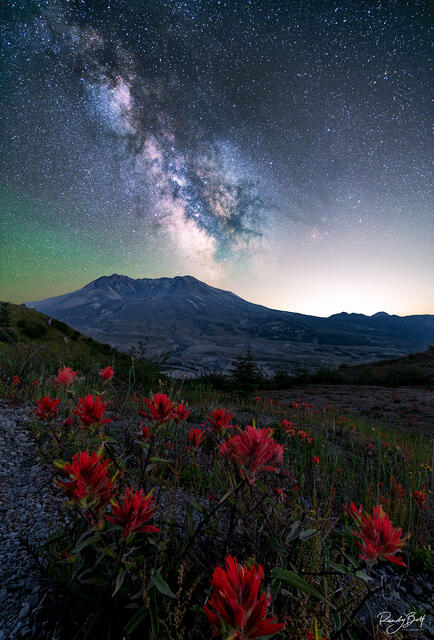 Milky Way galaxy over Mt. St. Helens national monument with the glow of Portland Oregon.