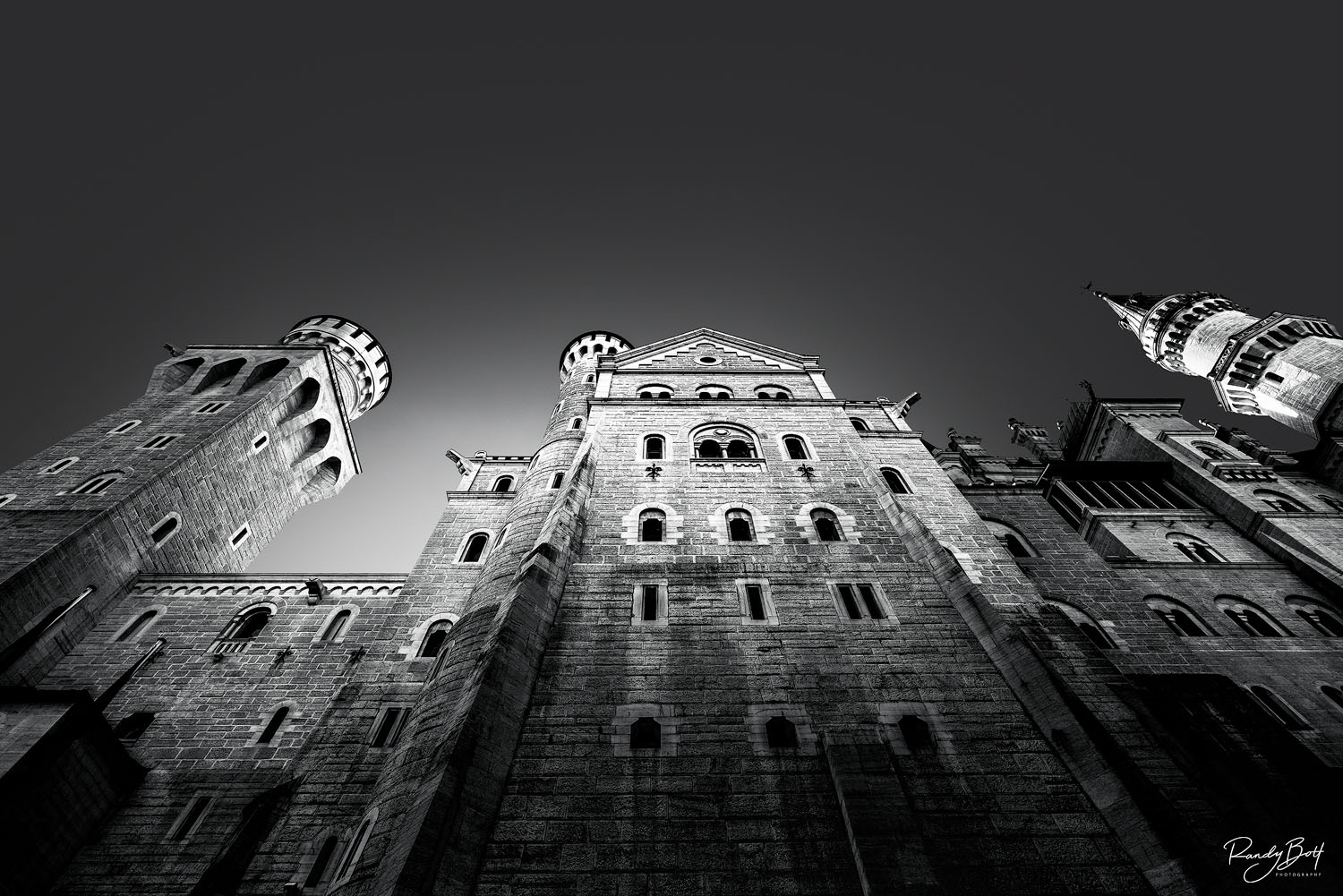 Castle View black and white photograph of the Neuschwanstien Castle looking towards the sky