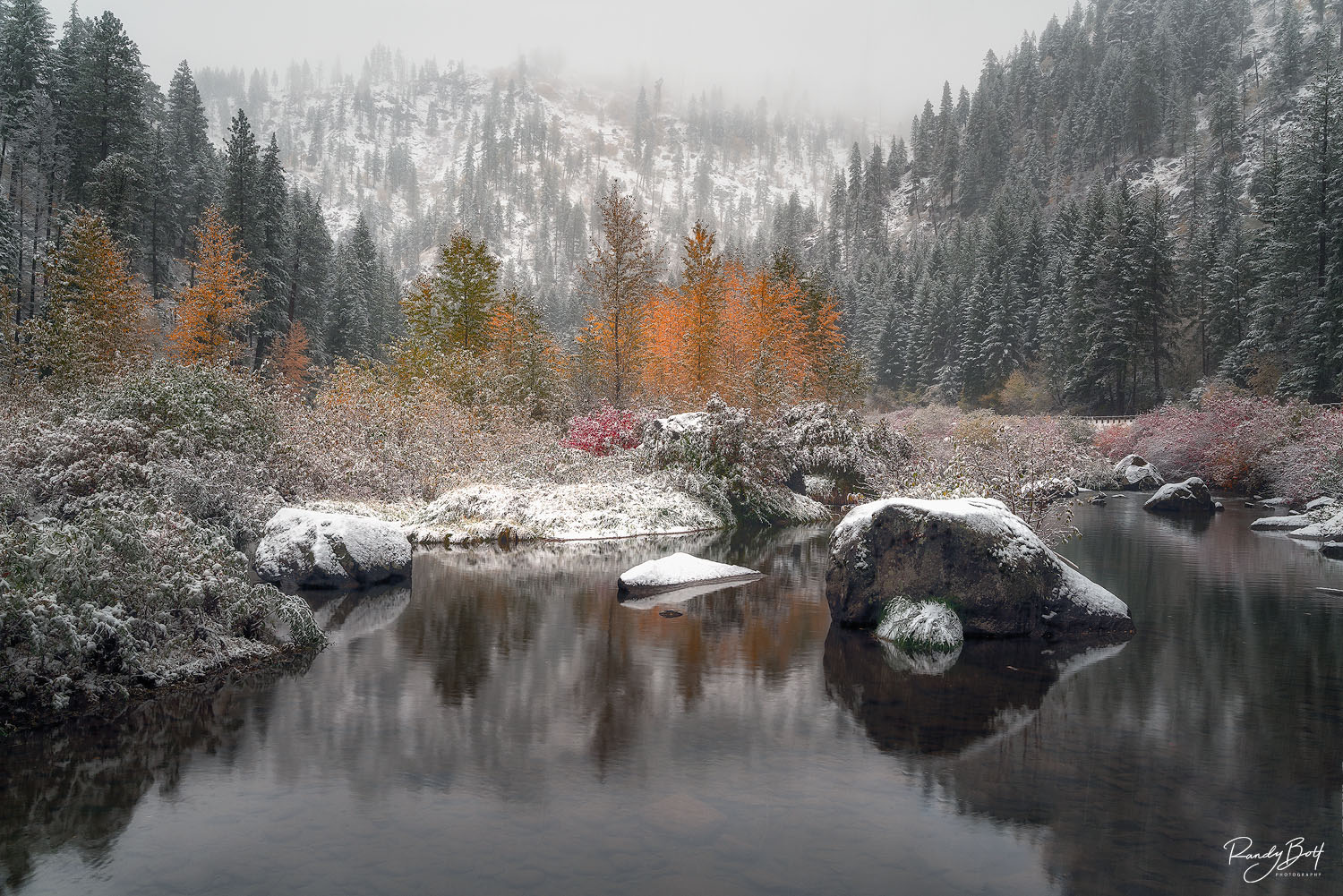 Coldwater Reflections fall color and snow in the Tumwater canyon with snow near Leavenworth, Washington