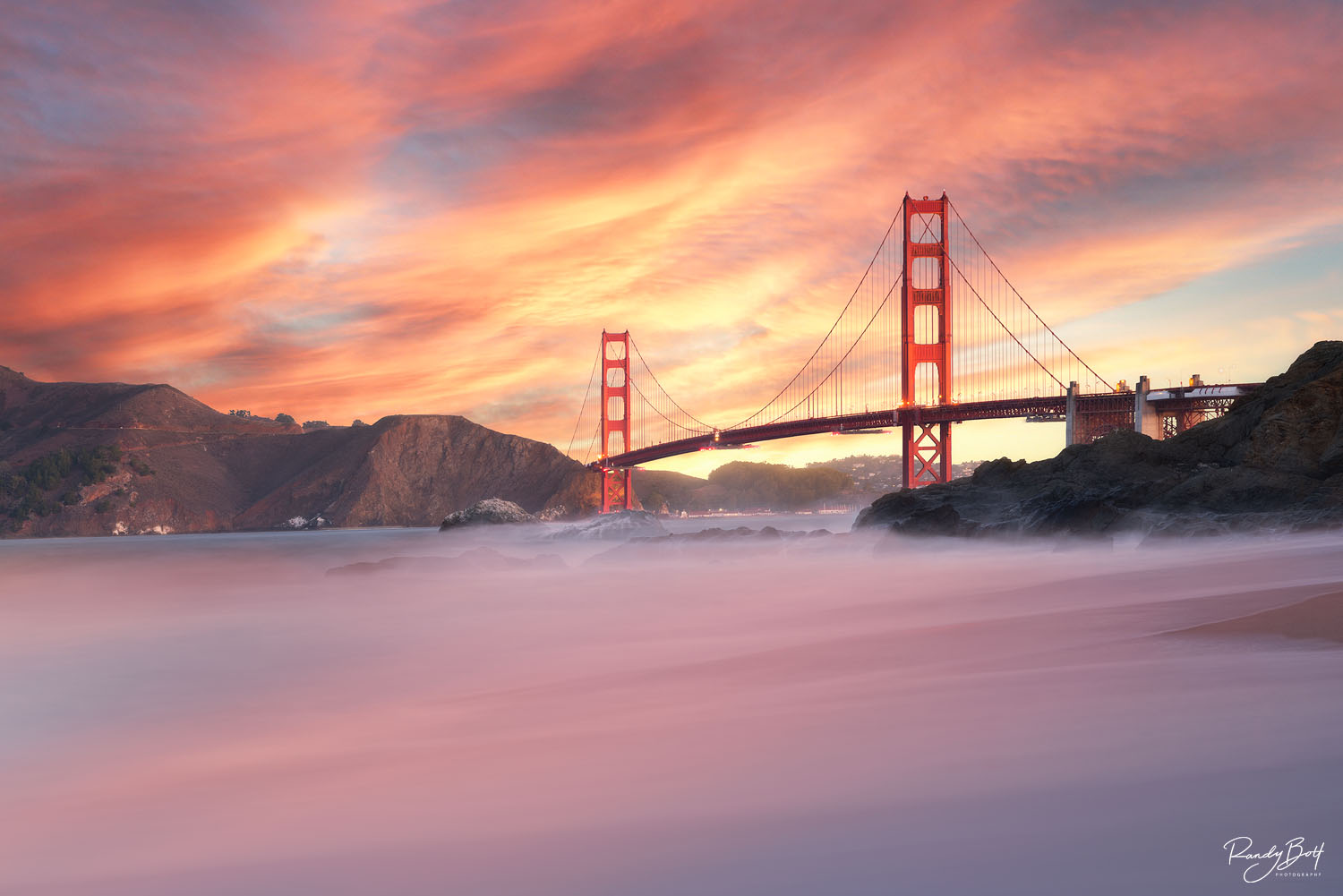 Golden Gate Bridge Sunrise sunrise over the Golden Gate Bridge from Baker beach in San Francisco, California.