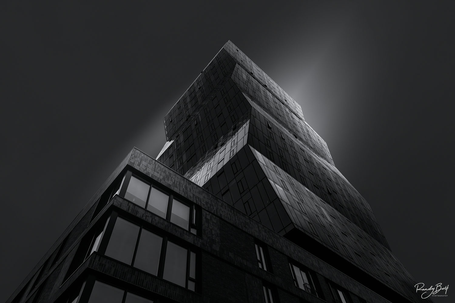 Misaligned A dark black and white image of a new building in downtown Seattle