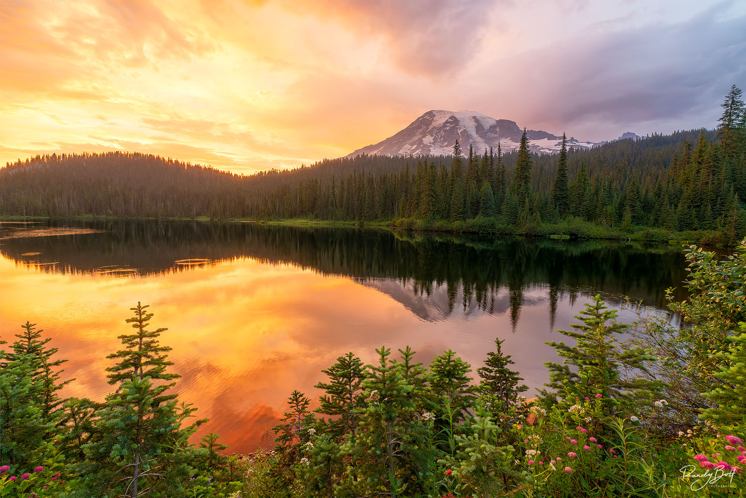 sunset over reflection lakes in mount rainier national park.