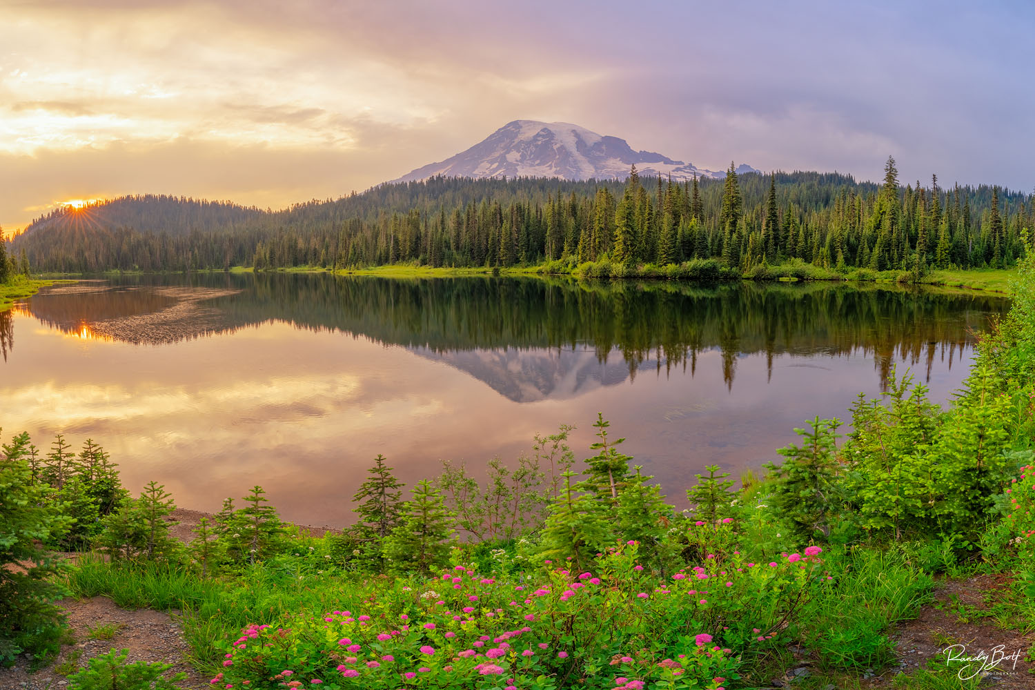 The serene lakes, adorned with the delicate blossoms of spirea, create a picturesque and captivating scene.